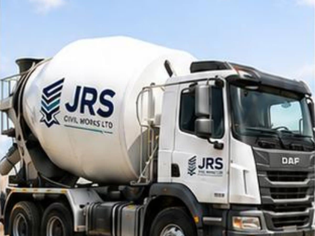 A JRS-branded truck-mounted concrete mixer parked on a compacted site surface.