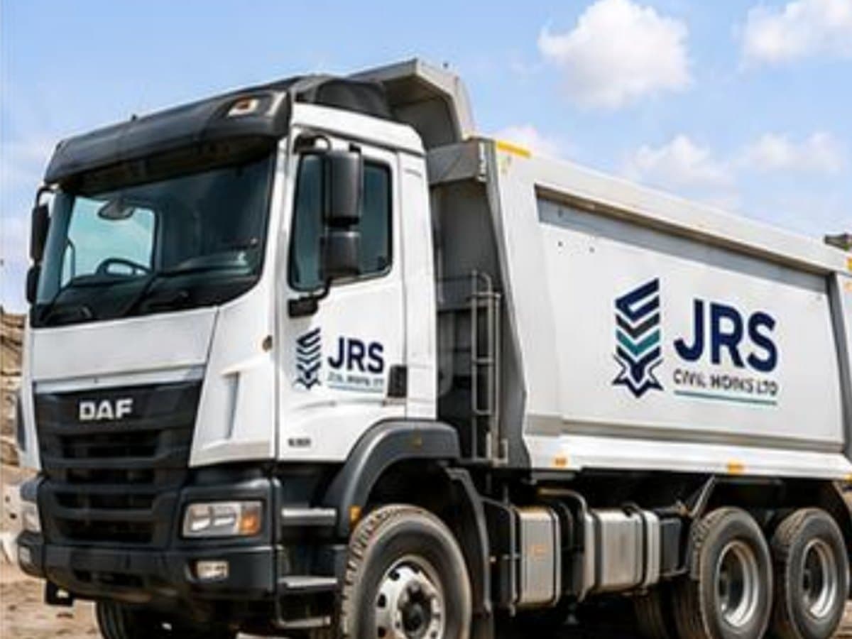 A JRS-branded tipper truck with a high-sided body standing ready for loading.
