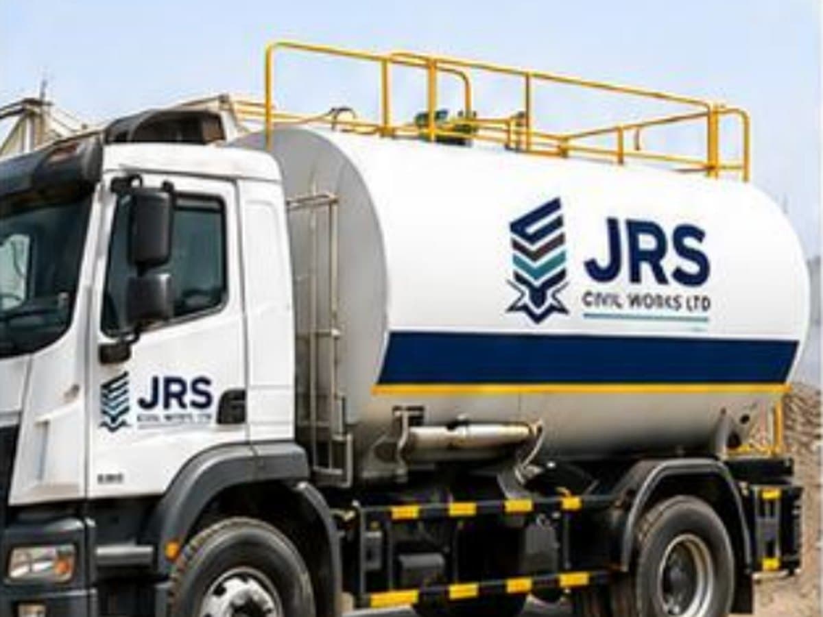 A JRS-branded water bowser tanker truck with a walkway rail along the tank.